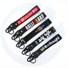 Chèques de chèques promotionnels de logo personnalisés en gros Carabiners Polyester Chaînes de clés de trèfle personnalisés de la cuite de bracelet